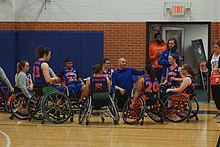 Head coach Jason Nelms with the Lady Movin' Mavs during a timeout in 2019 Great Britain vs. UT Arlington women's wheelchair basketball 2019 33 (UT Arlington timeout).jpg