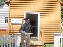Guide in period costume at the law office at Appomattox Guide at law office at Appomattox Park, VA IMG 4171.JPG