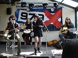 Halestorm performing in 2009. Left to right: Josh Smith, Arejay Hale (back), Lzzy Hale, Joe Hottinger