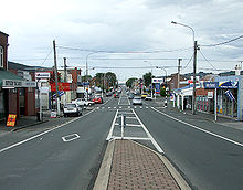 A turn lane (in New Zealand a "flush median") with a raised median in the forefront HillsideRdCaversham.jpg