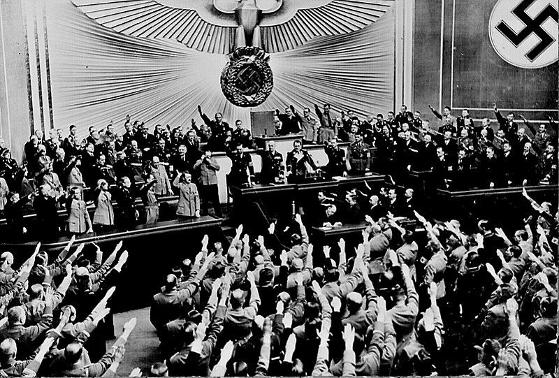 800px-Hitler_accepts_the_ovation_of_the_Reichstag_after_announcing_an_Anschluss_with_Austria%2C_Berlin%2C_March_1938.jpg
