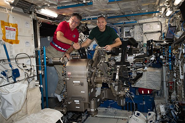 Bresnik(right) pictured with Paolo Nespoli in the Columbus module