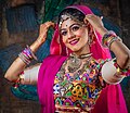 *Nomination Indian woman graceful performance with Rajasthani folk costume --PetarM 08:57, 26 June 2024 (UTC) * Discussion  Support Good quality. --Thi 22:56, 26 June 2024 (UTC)  Oppose Strange texture on the forehead (horizontal banding), needs discussion ReneeWrites 06:24, 27 June 2024 (UTC)
