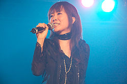 Okui 2008-ban a párizsi Japan Expo színpadán a JAM Project tagjaként