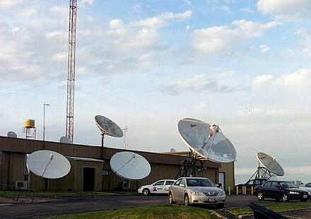 Side entrance to the KTVO newsroom and the large number of satellite dishes used by the station.