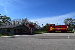 Avoca Mercantile and an Atchison, Topeka and Santa Fe Railway caboose in Avoca