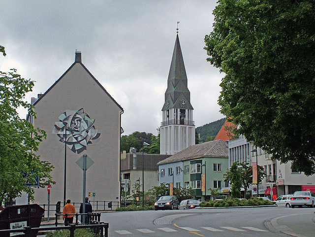 Molde's main street and commercial center. Molde Cathedral (orange roof on the far right) with its freestanding bell tower replaced the church that wa