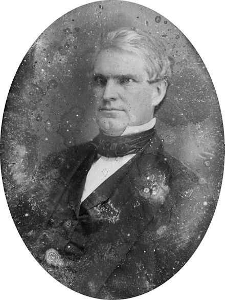 Nathan Kelsey Hall, half-length portrait, three-quarters to the left.jpg