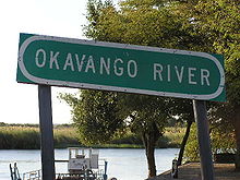 Okavango River through the park Okavango River Sign.jpg