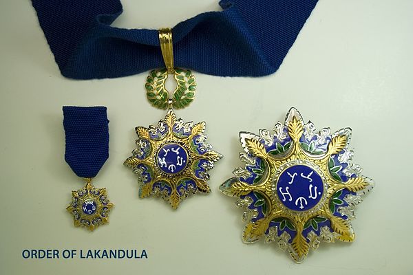 The badge on a neck ribbon, the star and miniature suspended from a chest ribbon of a Grand Officer of the Order of Lakandula.