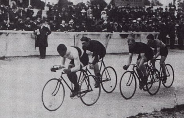An outdoor track race in Paris in 1908 featuring Major Taylor, the first African-American cyclist to become world champion