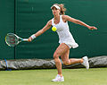 Petra Cetkovská competing in the second round of the 2015 Wimbledon Qualifying Tournament at the Bank of England Sports Grounds in Roehampton, England. The winners of three rounds of competition qualify for the main draw of Wimbledon the following week.