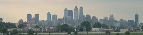 View of Philadelphia skyline from Citizens Bank Park in 2004 with William Penn's statue visible in the right and much taller skycrapers, including One Liberty Place, on the left