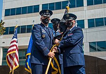 Guetlein (right) accepts the Space Systems Command flag from Gen John W. Raymond (left) during the SSC activation ceremony, 2021 SSC stands up, Guetlein takes command 210813-X-DC888-013.jpg