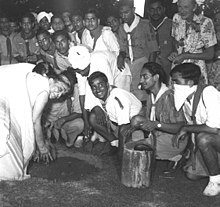 Naidu plants a tree in Mehrauli, Delhi, 1947