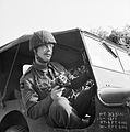 Sergeant Norman Midgley, a photographer with No. 5 Section of the Army Film and Photographic Unit, in a jeep during the battle for Caen in Normandy, 24 July 1944. B7947.jpg