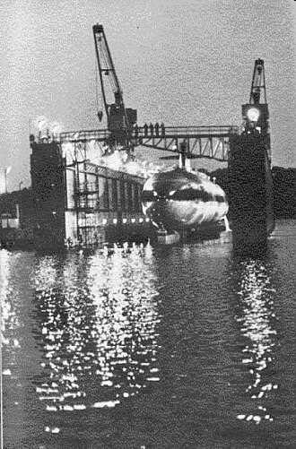 Shippingport (ARDM-4) with USS Philadelphia (SSN-690) high and dry in her floating dock undergoing a routine hull inspection at Naval Sub Base, in Groton, CT Shippingport (ARDM-4).jpg