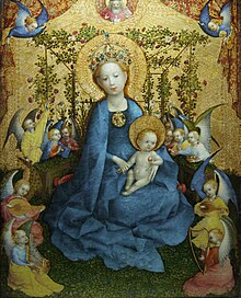 The Blessed Virgin Mary is depicted in a rose-garden with angels playing music. Roses are a symbol of Mary. Stefan Lochner Madonna im Rosenhag.jpg