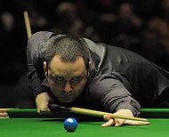 Stephen Maguire (pictured) reached his first ranking quarter-final since the 2022 World Championship, but lost 4-5 to Judd Trump. Stephen Maguire at German Masters Snooker Final (DerHexer) 2012-02-05 10.jpg