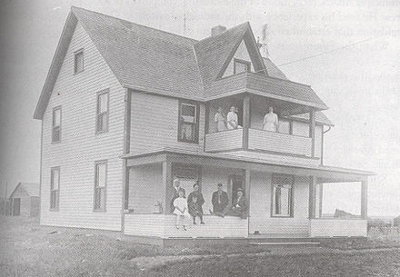 Stewart's farmhouse in Killam; Stewart himself is standing at lower left.