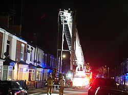 Humberside Fire and Rescue Service firefighters from Calvert Lane fire station begin to pack up after securing a loose chimney damaged by Storm Eunice in East Hull