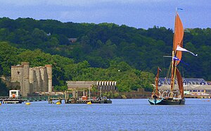 A Thames Barge sails past the depot: Upnor Castle (left), 'B' Magazine (centre), No. 5 Shell Store (right). Thames Barge off Upnor Castle.jpg