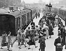 Women classed as enemy aliens being escorted by police and officials to board trains at a London station, at the start of their journey for internment on the Isle of Man early in the Second World War. The Home Front in Britain during the Second World War HU36121.jpg