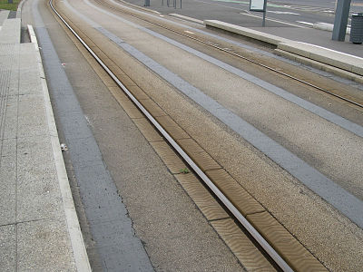 A central rail embedded in the road guides GLT vehicles while they are in their "tram-like" mode.