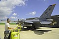 U.S. Air Force Senior Airman Stephen Mrozynski, an avionics specialist assigned to the 8th Aircraft Maintenance Squadron, assists Col. S. Clinton Hinote, commander of the 8th Fighter Wing, with flight 130814-F-LD870-214.jpg