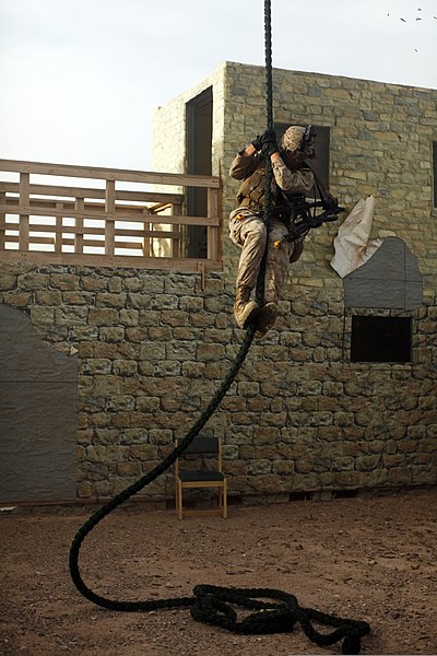 File:U.S. Marine Corps Gunnery Sgt. David Shaffer, assigned to India Company, 3rd Battalion, 6th Marine Regiment, 2nd Marine Division, fast-ropes out of a UH-1Y Venom helicopter during a mock helicopter raid at Yuma 140409-M-HR724-003.jpg