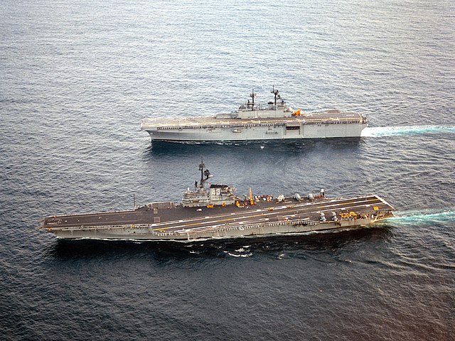 Wasp cruising alongside the aircraft carrier Coral Sea in September 1989