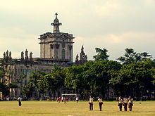 The Royal and Pontifical University of Santo Tomas, established by the Dominican missionaries in 1611 and raised to the rank of a university in 1645 by Pope Innocent X through the petition of Philip IV of Spain, is currently the educational institution with the oldest extant university charter in Asia. UST Main Building from the field.JPG