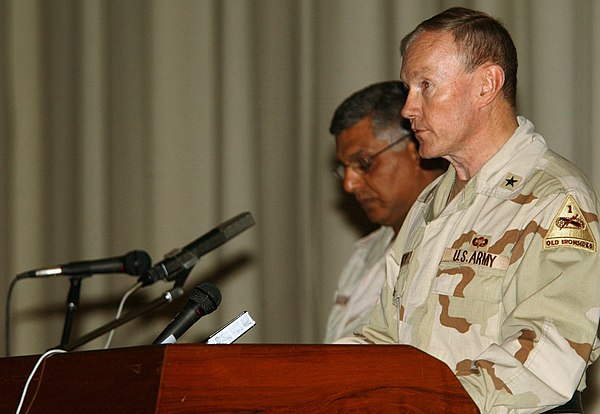 Brigadier General Dempsey, commander, 1st Armored Division, gives a few remarks to the Iraqis who served during previous wars in Iraq at a recognition