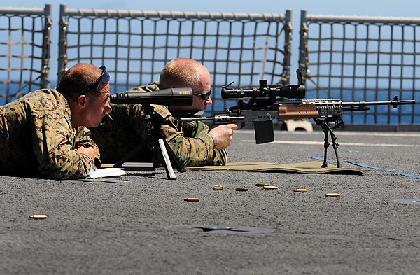 Modern military snipers are often skilled at long range shooting. Behind the shooter lies a spotter, looking for the bullet impact and suggesting adju