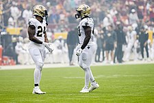 Washington (left) and fullback Alexander Armah playing for the Saints in 2021. WFT vs. Saints (51582988918).jpg