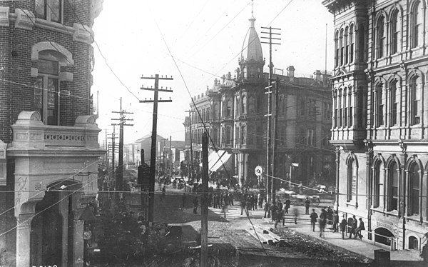 Looking west on Mill Street (today's Yesler Way) across Front Street (today's First Avenue) June 5, 1889, one day before this district burned. Korn block on left; Yesler-Leary Building, center; Occidental Hotel, right.