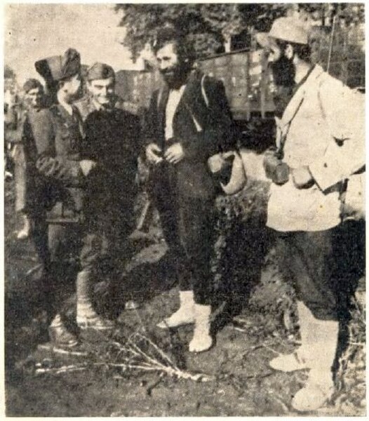 Chetniks with Italians, waiting to be transported by train.