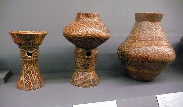 Three Chalcolithic ceramic vessels (from left to right): a bowl on stand, a vessel on stand and an amphora, ca. 4300–4000 BC; from Scânteia, Romania a