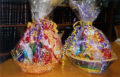 Gaily wrapped baskets of sweets, drinks and other foodstuffs given as mishloach manot on Purim day.