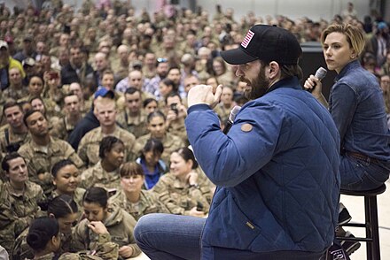 Evans and Scarlett Johansson attending the USO Holiday Tour at Bagram Air Base, Afghanistan in 2016
