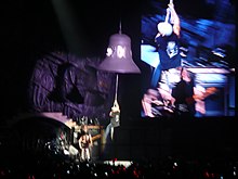 Johnson hangs on to a bell while performing the song "Hells Bells" ACDC - Hells Bells.JPG