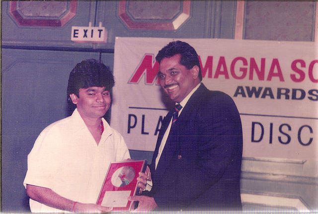 Rahman (left) receiving a platinum award at the MagnaSound Awards; MagnaSound released his first film soundtrack, Roja, in 1992.