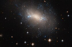 NGC 2337 је неправилна галаксија која се налази 25 милиона светлосних година од нас у сазвежђу Риса.[16]