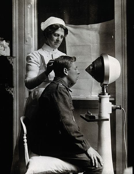 File:A young uniformed man sitting with a pillow on his chair, fa Wellcome V0029751.jpg