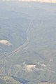 Aerial - looking along power lines NE of Mt. Rainier 01 (9795094866).jpg