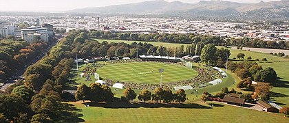 Aerial view of Hagley Oval cricket ground: North is the Botanic Gardens end, East is the historic Umpires' Pavilion side, South is the Port Hills end and West is the Christ's College cricket ground end. Aerial view of Hagley Oval.jpg