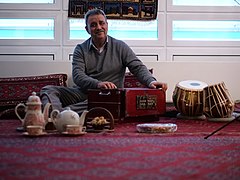 Image 2Elements of Afghan culture including: tabla and harmonium musical instruments, an Afghan carpet, teapot, and sheer pira dessert (from Culture of Afghanistan)
