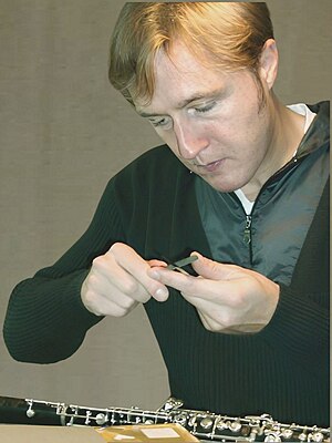 Oboist Albrecht Mayer preparing reeds for use....