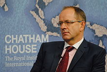 Andrew Witty wearing a suit