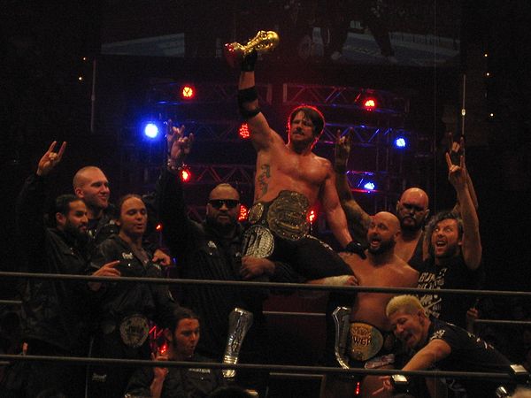 Omega (far right) as a member of Bullet Club in 2015